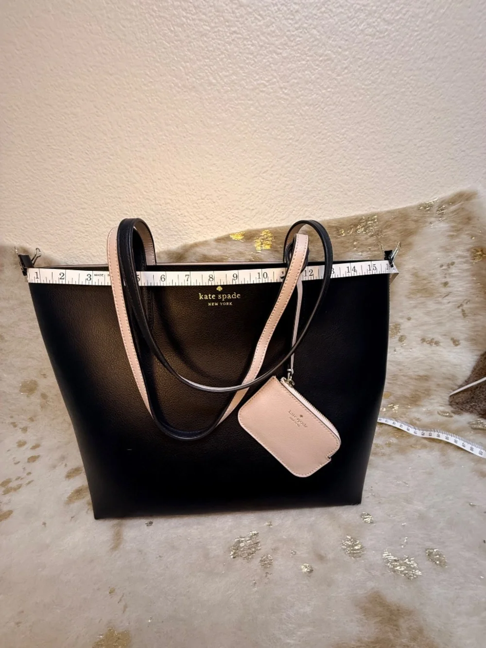 Stylish Kate Spade reversible tote in classic black with blush pink interior